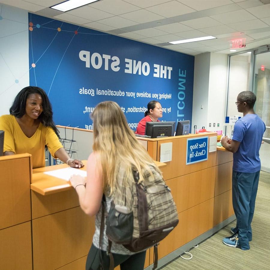 students getting help at Onestop service counter.